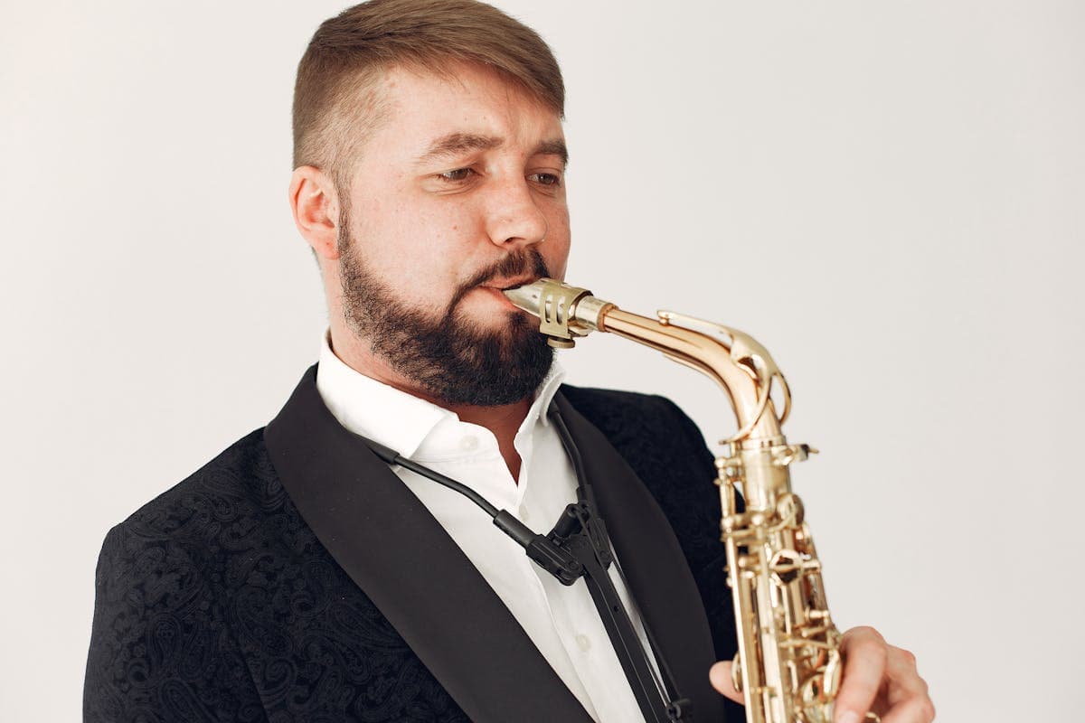Man in a wide-shouldered drape-cut double-breasted suit with vintage jazz-age styling