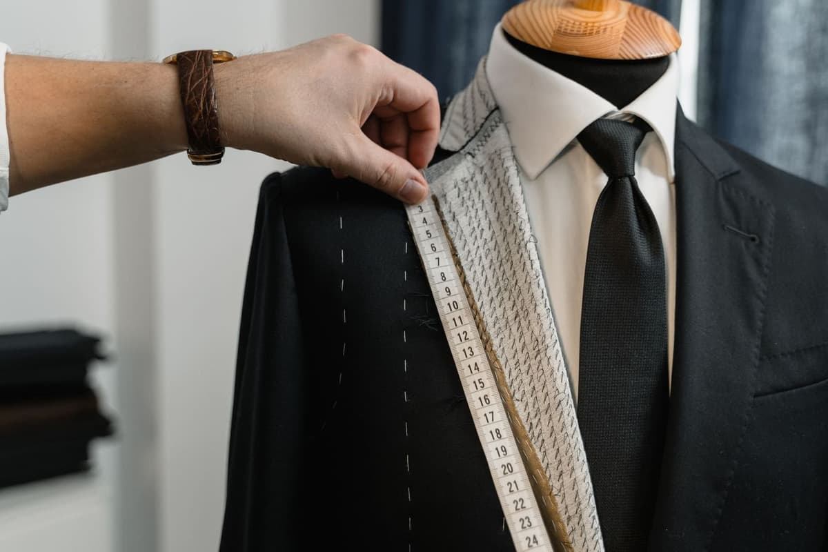 Close-up of a shirt collar and a tie knot sitting in the collar opening