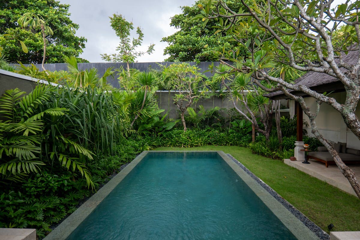 A private villa with a swimming pool and garden, the kind large families rent in Hoi An