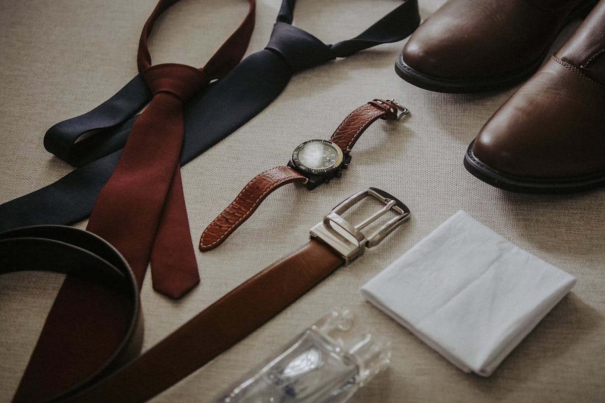 Mood board of tailored suit and jacket style references pinned together, the kind of Pinterest reference customers upload before the AI generates a garment preview