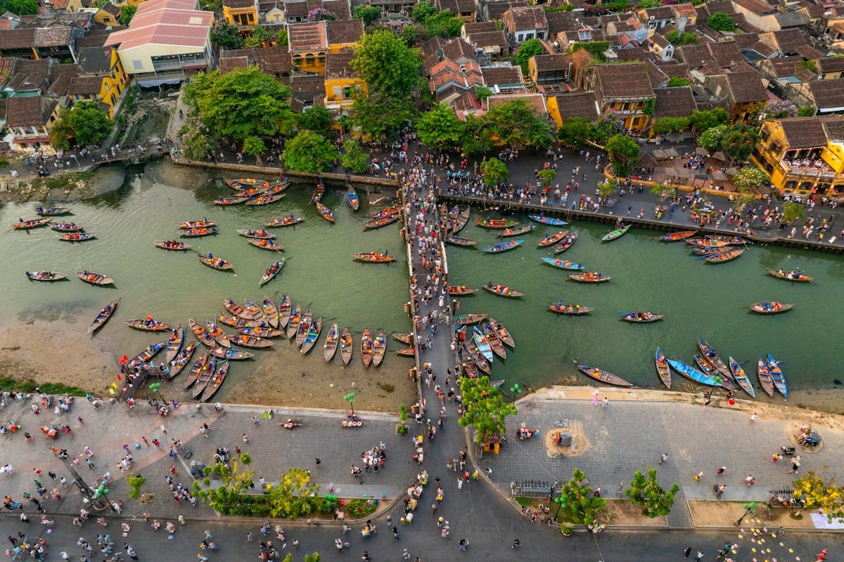 View over Hoi An Old Town and the Thu Bon River, the UNESCO World Heritage backdrop where ao dai is made, fitted, and photographed
