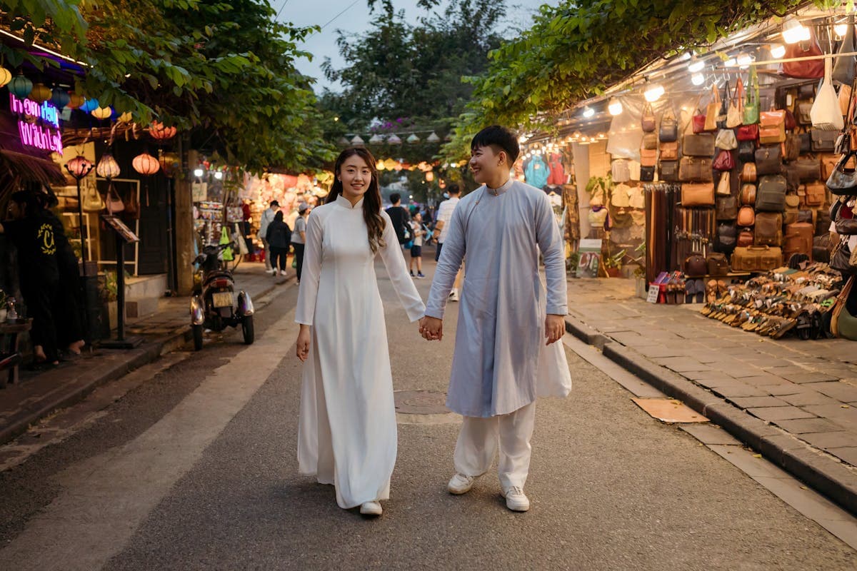 Lantern-lit streets of Hoi An ancient town in Vietnam at dusk, where Australian travellers get custom suits made at Nathan Tailors