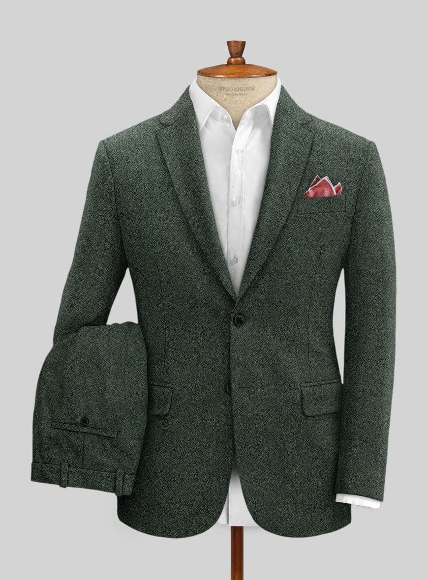 A green heavy tweed two-piece suit displayed on a tailor's dress form