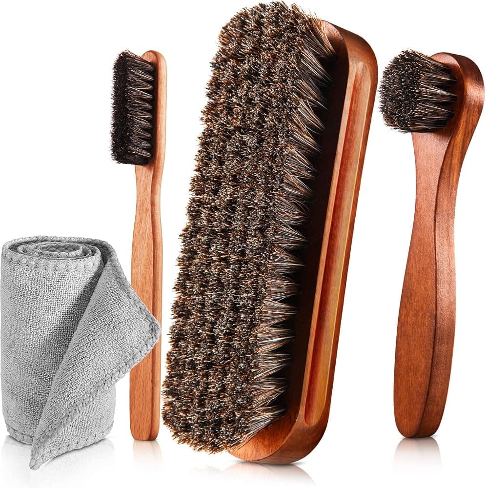 A horsehair shoe-shine brush and polish kit