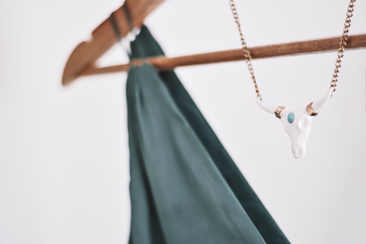 A minimalist bias-cut silk slip wedding dress with a clean boat neckline and no embellishment, the defining elements of the CBK design