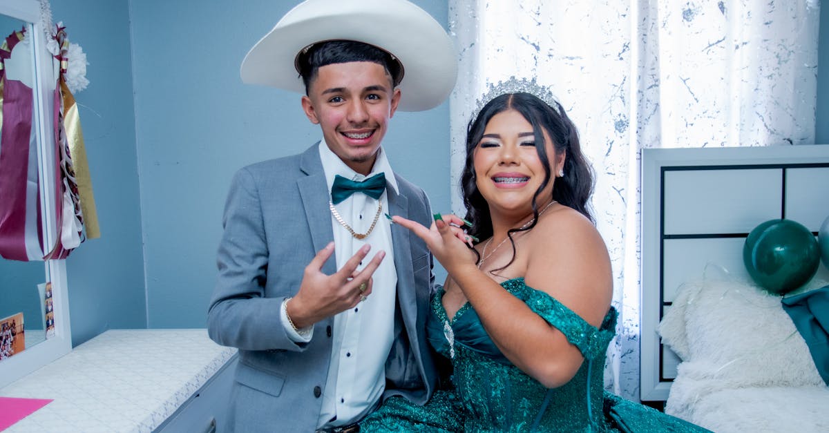 Group of high school students dressed for a formal dance event with a mix of short cocktail dresses and sharp suits