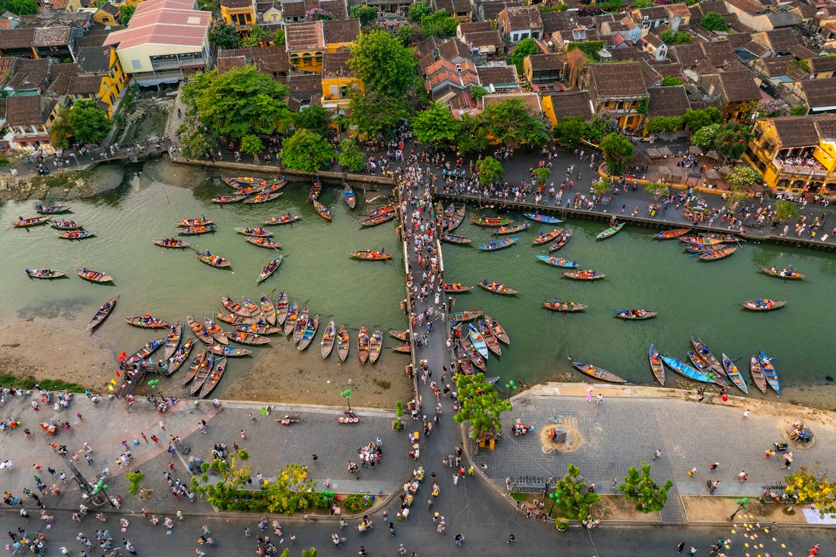 View over Hoi An Old Town and the Thu Bon River, the UNESCO World Heritage backdrop where ao dai is made, fitted, and photographed