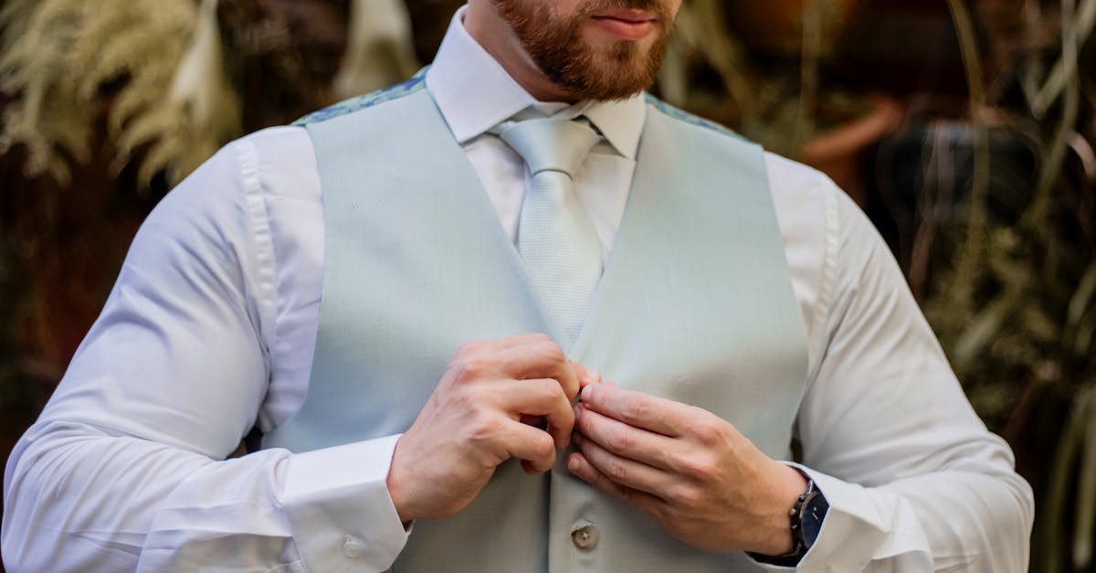 Professional man walking through Midtown Manhattan in a fleece vest over a crisp dress shirt and tailored trousers