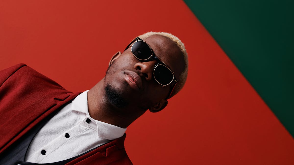 Confident young man in a bold custom suit -- the kind of fit that turns a draft night walk to the stage into a statement