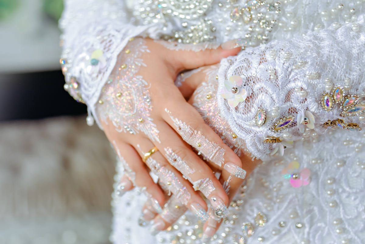 Hand-sewn beading and embellishment detail on custom wedding dress