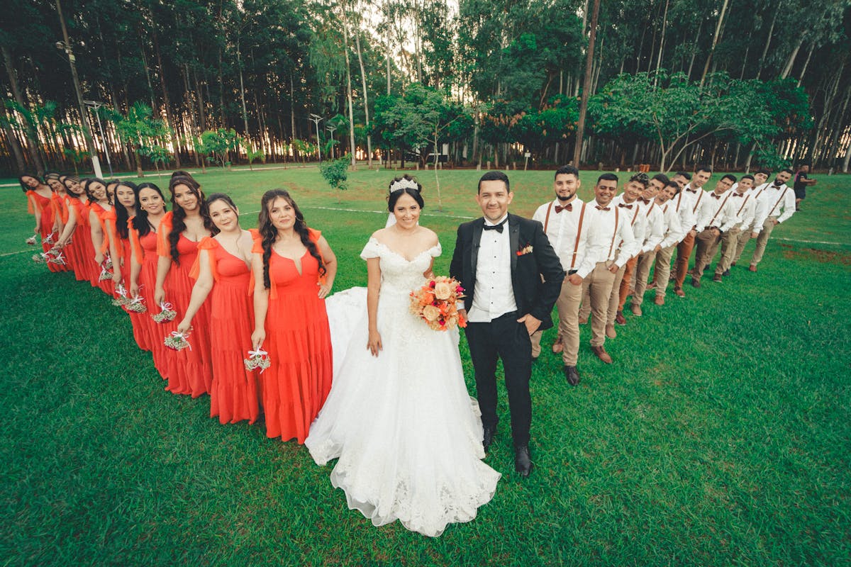 A coordinated wedding party lined up together in matching attire, the visual goal a single rendered mood board is meant to lock in before anyone orders