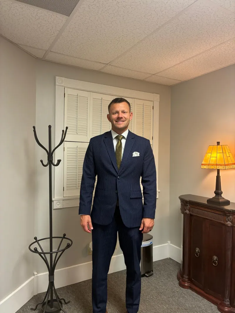 Custom navy pinstripe two-piece suit made by Nathan Tailors, worn by the customer in Ohio after a remote order