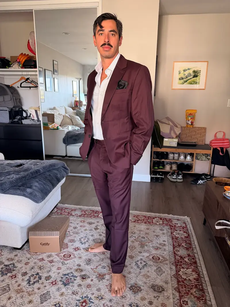 Custom plum two-piece suit made by Nathan Tailors, photographed by the customer at home in California after a remote order
