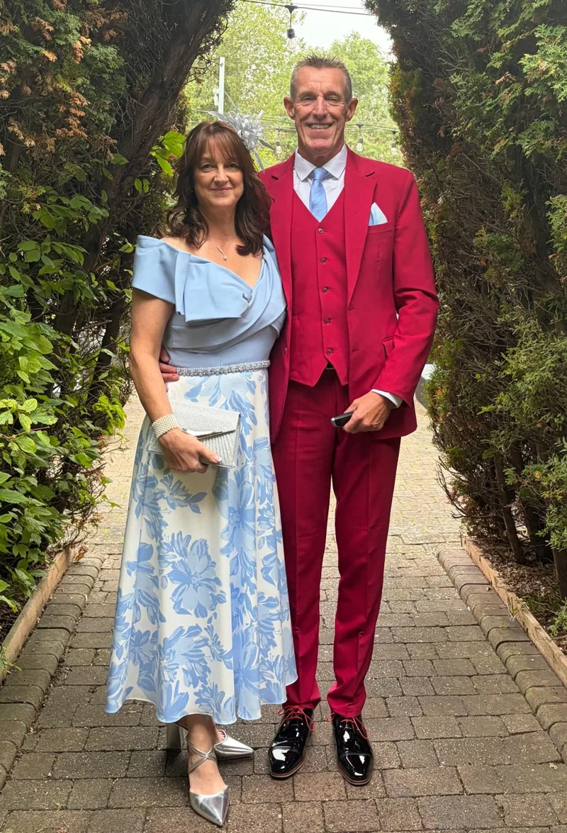 Custom red three-piece suit made by Nathan Tailors, worn by the customer at a wedding in the UK after a remote order